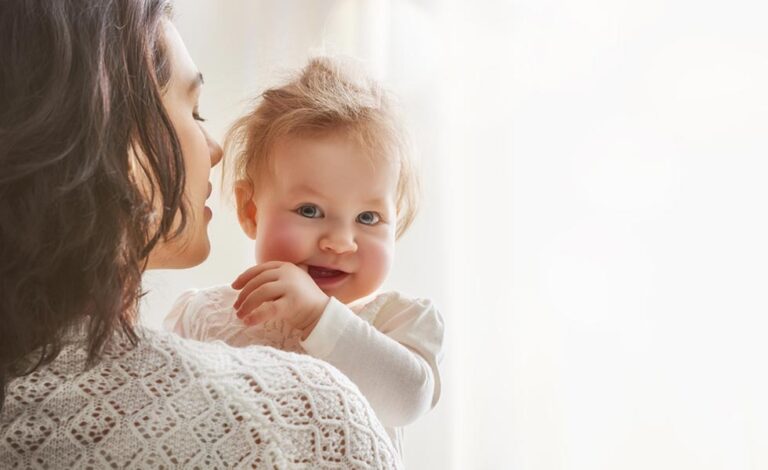 What you need to know about parental leave - a woman holding a baby
