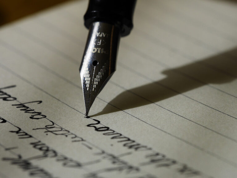 How to get started with estate planning - close up of a fountain pen writing.